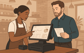 Barista using POS software in a coffee shop to analyze sales and improve business performance