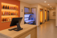 Modern tanning salon interior with POS system at checkout counter
